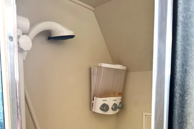 Slide: The Image of Shower area in 1999 Ocean Alexander Classico 450 yacht with soap dispenser. - 21