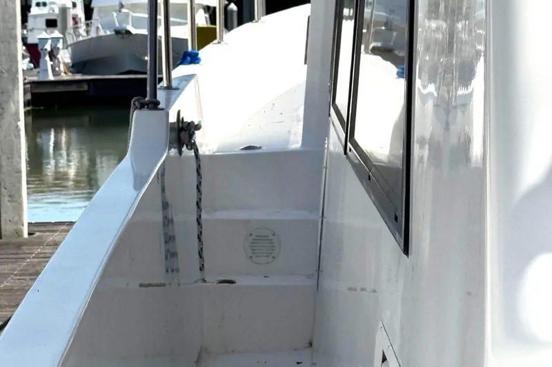 Slide: The Image of 1999 Ocean Alexander Classico 450 yacht side view at marina. - 6