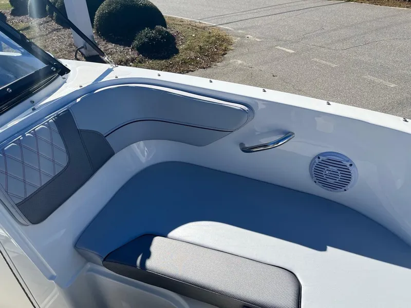 Slide: The Image of 2024 Bayliner VR4 boat interior seating area with speaker and handle. - 18