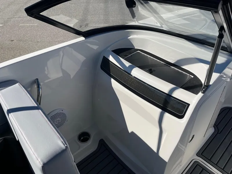 Slide: The Image of 2024 Bayliner VR4 boat interior with seating and storage compartment. - 20