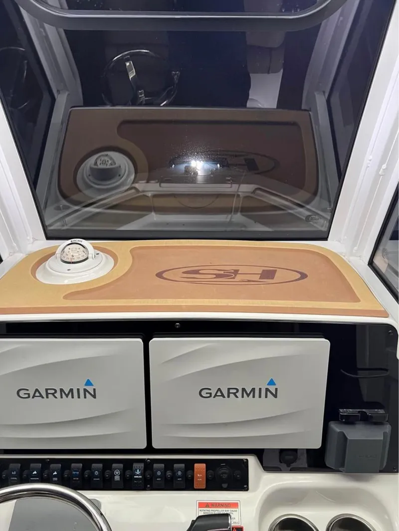 Slide: The Image of 2018 Sea Hunt 235 boat dashboard with Garmin navigation systems. - 6