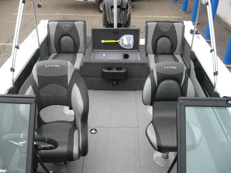 Slide: The Image of 2024 Lund 1775 Crossover XS boat interior with seating and storage. - 19