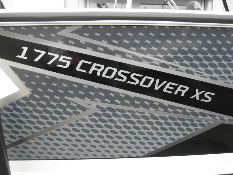 Slide: The Image of Lund 1775 Crossover XS 2024 model boat logo in chrome on black background. - 3
