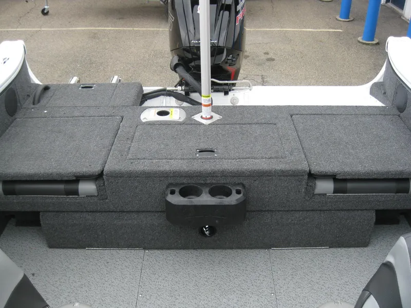 Slide: The Image of 2024 Lund 1775 Crossover XS boat interior with steering wheel and seating. - 8