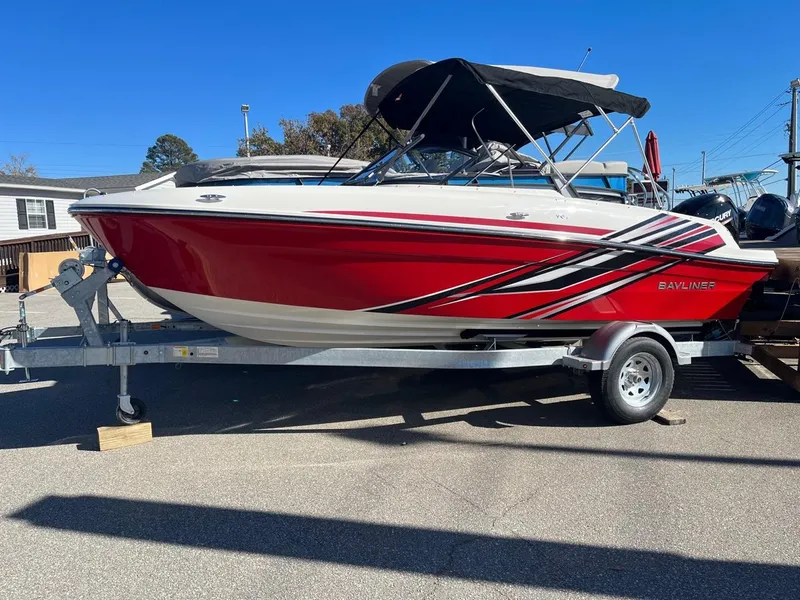Slide: The Image of 2024 Bayliner VR4 boat with red and white design on trailer. - 1