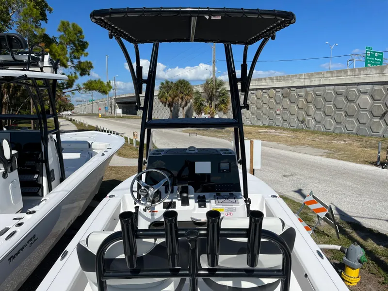 Slide: The Image of 2025 Tidewater 25 TPC boat with T-top and center console. - 10
