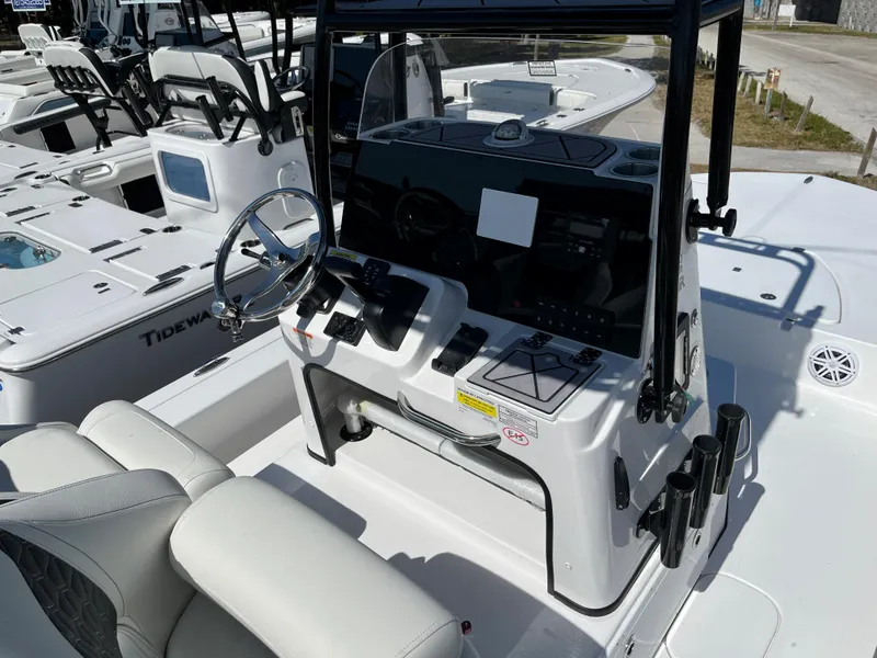 Slide: The Image of 2025 Tidewater 25 TPC boat console with steering wheel and controls. - 11