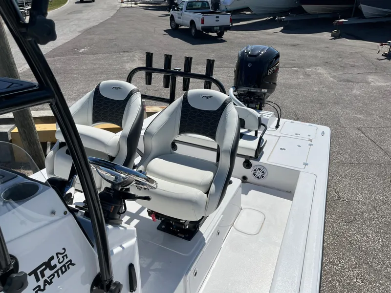 Slide: The Image of 2025 Tidewater 25 TPC boat with dual seats and outboard motor. - 14