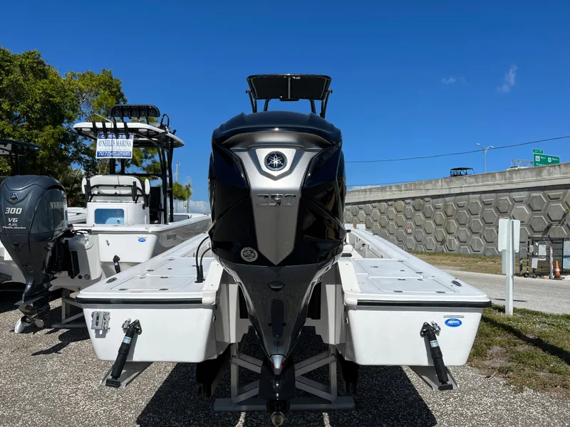 Slide: The Image of 2025 Tidewater 25 TPC boat with powerful outboard motor, displayed outdoors. - 3