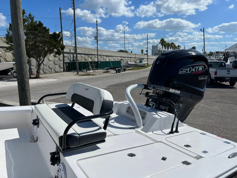 Slide: The Image of 2025 Tidewater 25 TPC boat with Yamaha SHO engine, docked under a sunny sky. - 5