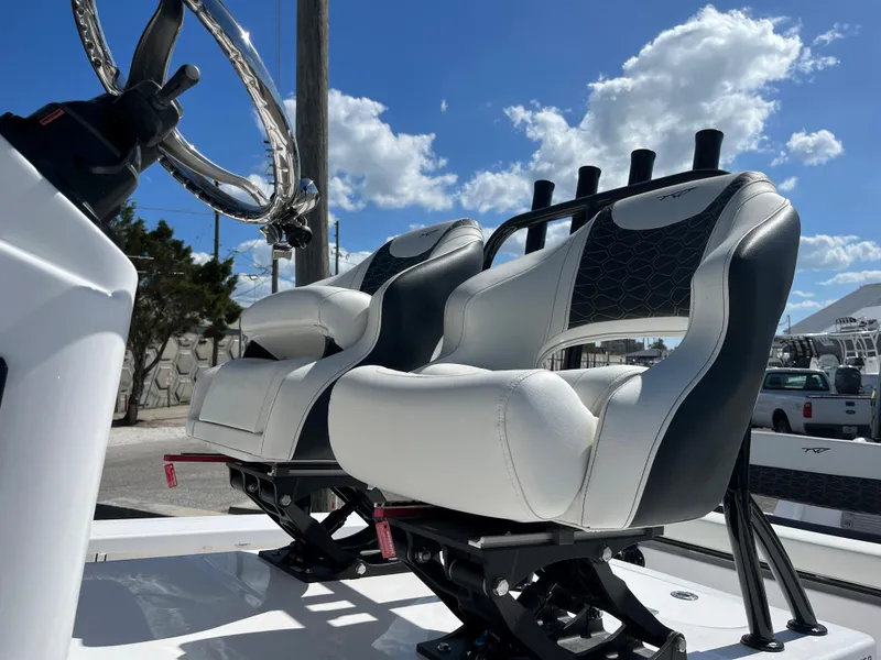 Slide: The Image of 2025 Tidewater 25 TPC boat seats under a sunny sky. - 8