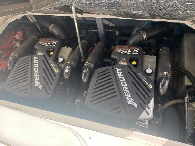 Slide: The Image of Twin Mercury engines in a 2001 Sea Ray Sundancer boat. - 6