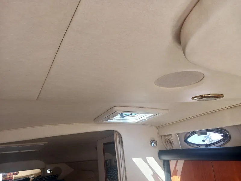 Slide: The Image of Interior view of 2001 Sea Ray Sundancer boat cabin ceiling with porthole and lighting. - 8