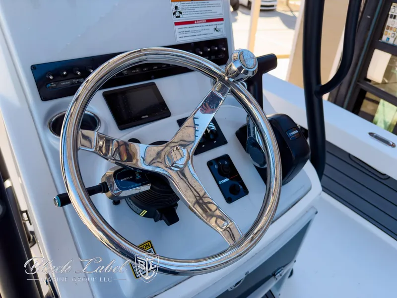 Slide: The Image of Steering wheel of 2024 Pathfinder TRS 2200 boat with control panel and gauges. - 20