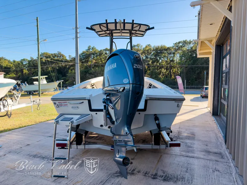Slide: The Image of 2024 Pathfinder TRS 2200 boat with Yamaha 200 engine, parked outdoors. - 3