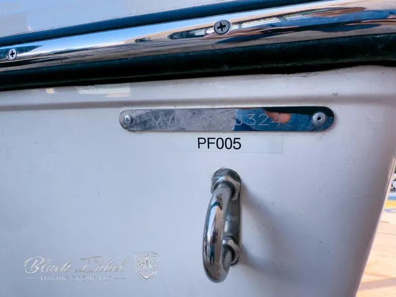 Slide: The Image of 2024 Pathfinder TRS 2200 boat detail with identification plate and handle. - 4
