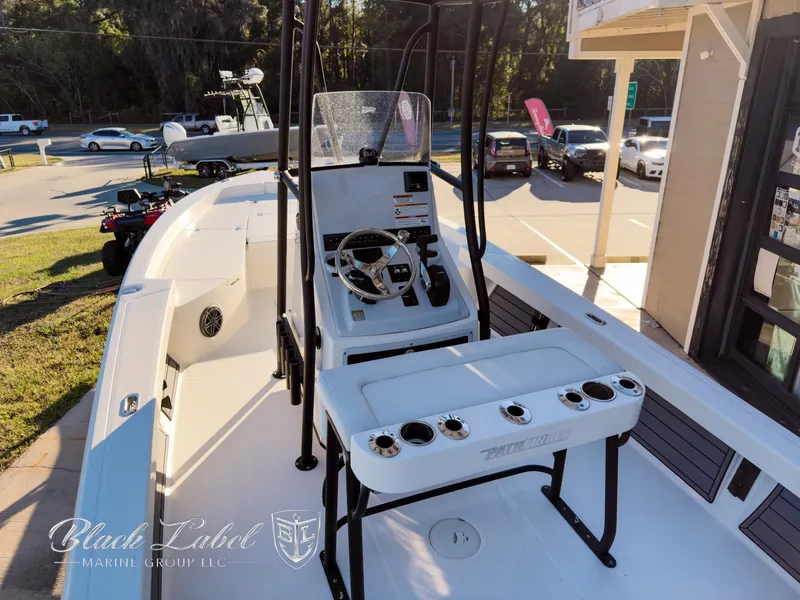 Slide: The Image of 2024 Pathfinder TRS 2200 boat interior with steering console and rod holders. - 5