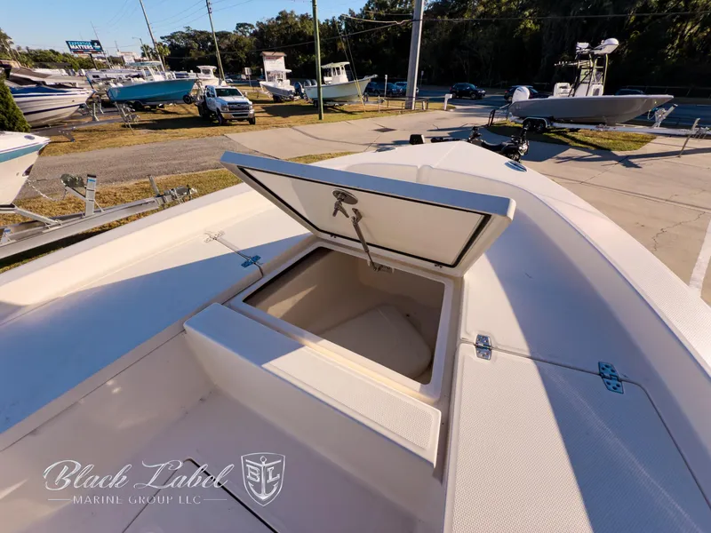 Slide: The Image of 2024 Pathfinder TRS 2200 boat with open storage compartment, displayed at Black Label Marine Group. - 8