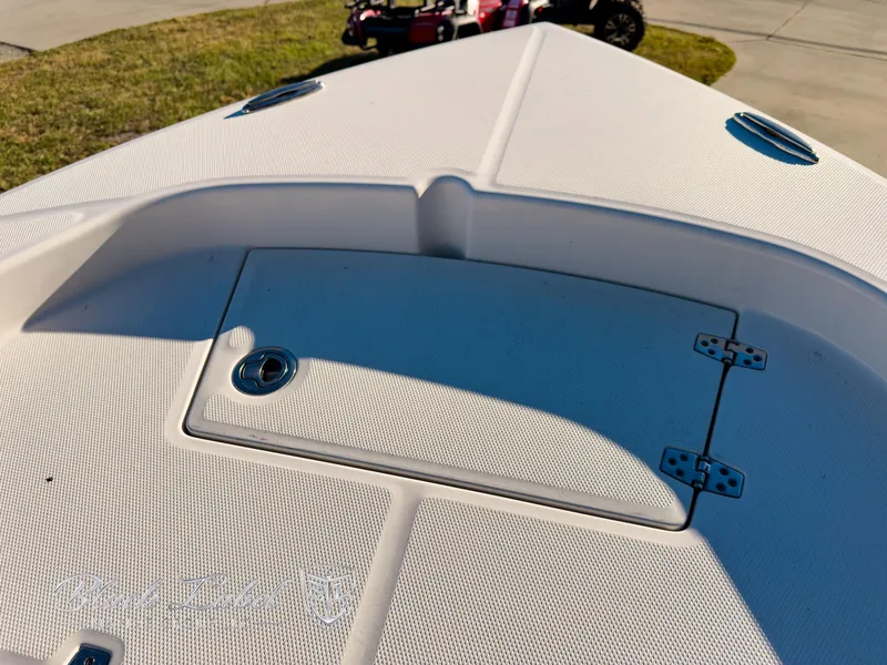 Slide: The Image of 2024 Pathfinder TRS 2200 boat deck with storage compartment and hinges. - 9
