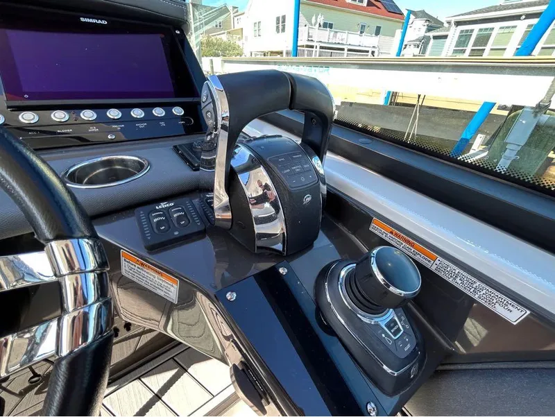 Slide: The Image of Control panel of a 2019 Monterey 385 SE boat with joystick and throttle. - 11