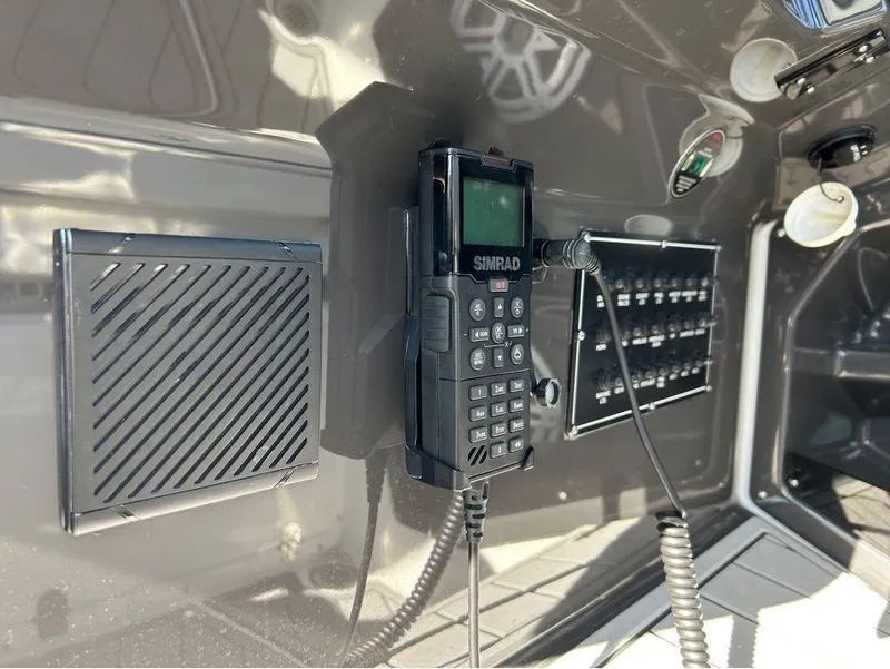 Slide: The Image of 2019 Monterey 385 SE boat control panel with Simrad radio. - 12