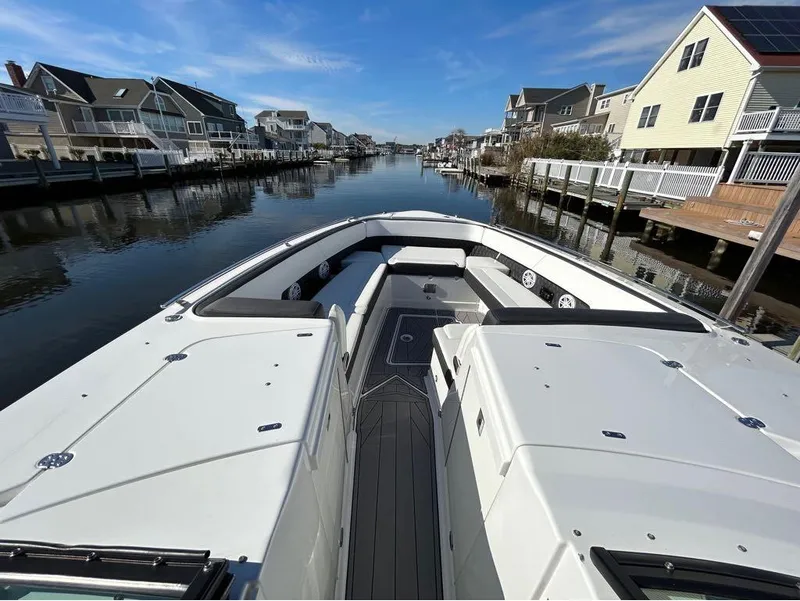 Slide: The Image of 2019 Monterey 385 SE boat docked in a residential canal. - 14