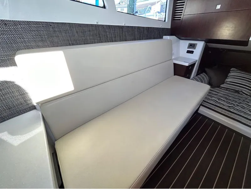 Slide: The Image of 2019 Monterey 385 SE interior cabin with beige seating and modern design. - 23