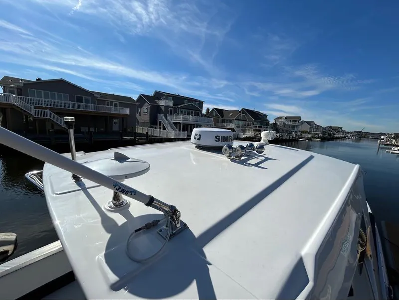 Slide: The Image of 2019 Monterey 385 SE boat docked in a residential marina. - 26