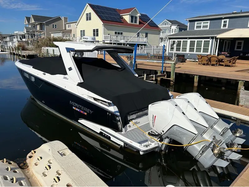 Slide: The Image of 2019 Monterey 385 SE boat docked in a residential marina. - 27