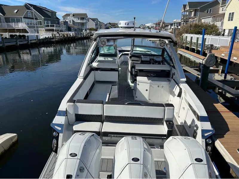 Slide: The Image of 2019 Monterey 385 SE boat docked in a residential marina. - 3