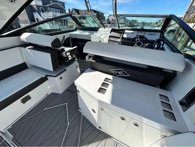 Slide: The Image of 2019 Monterey 385 SE boat interior with modern seating and control panel. - 5