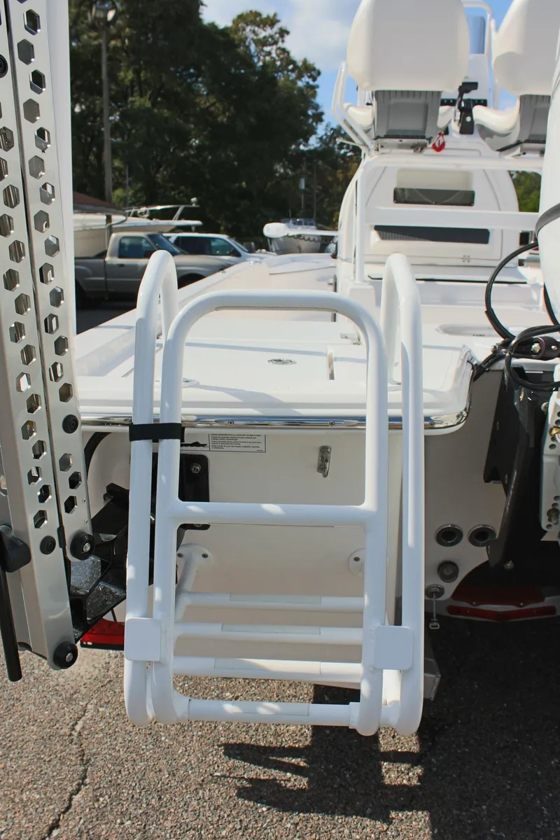 Slide: The Image of 2024 Blue Wave 2200 STL boat with rear ladder and seating. - 19