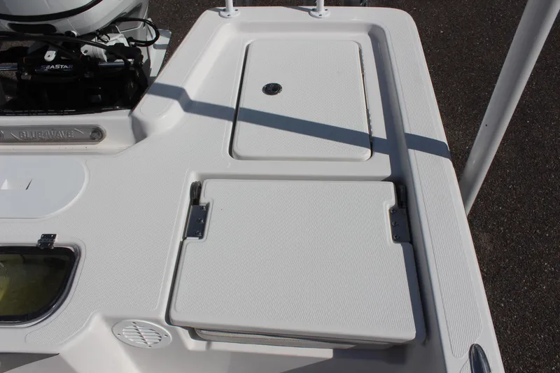 Slide: The Image of 2024 Blue Wave 2200 STL boat deck with storage compartments. - 23