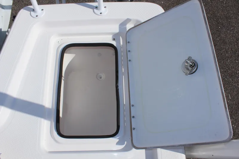 Slide: The Image of Open storage compartment on a 2024 Blue Wave 2200 STL boat. - 25
