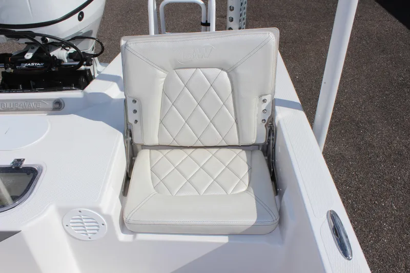 Slide: The Image of 2024 Blue Wave 2200 STL boat with white cushioned seat. - 26