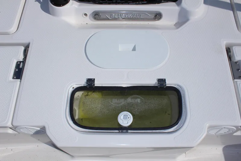 Slide: The Image of 2024 Blue Wave 2200 STL boat livewell and storage compartments. - 28