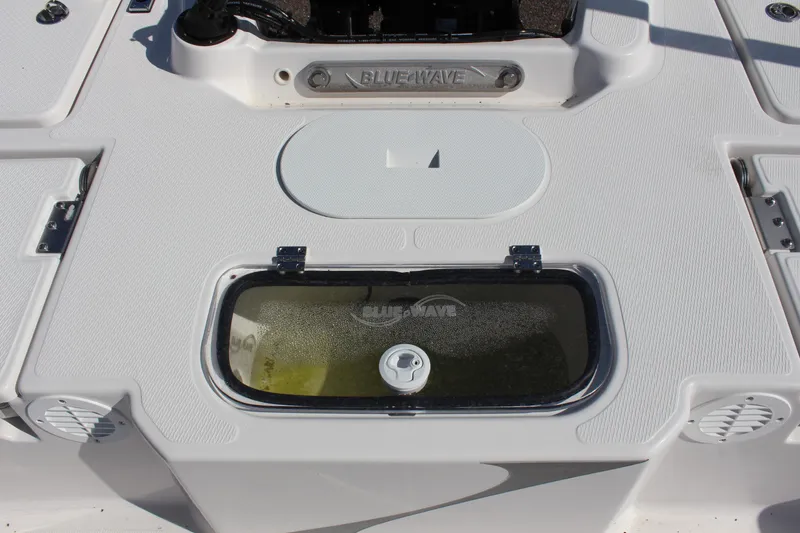 Slide: The Image of 2024 Blue Wave 2200 STL boat deck with storage compartments and livewell. - 29