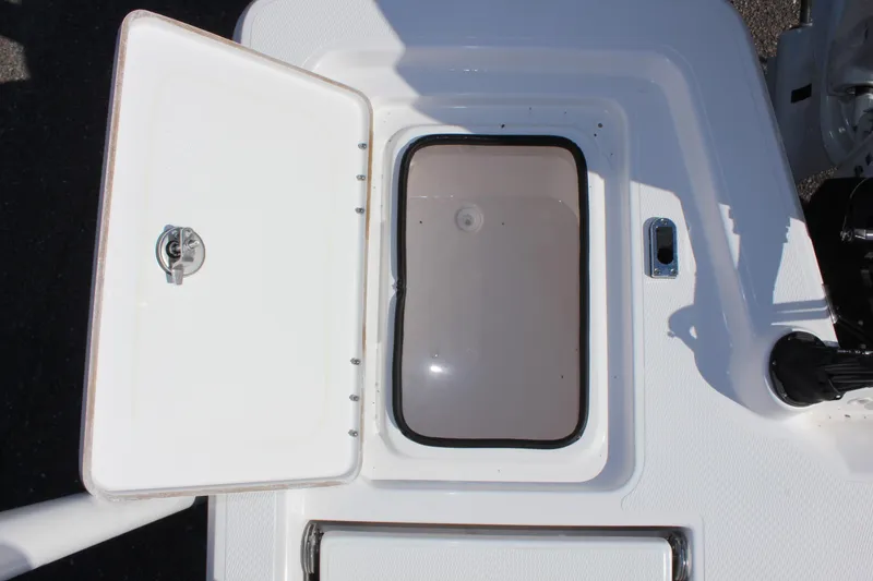 Slide: The Image of Open storage compartment on 2024 Blue Wave 2200 STL boat. - 32