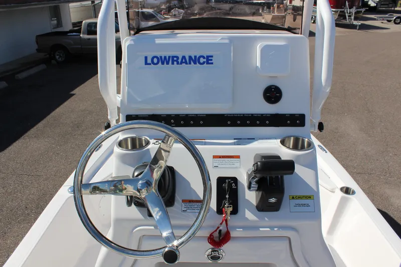 Slide: The Image of 2024 Blue Wave 2200 STL boat console with Lowrance electronics and steering wheel. - 39