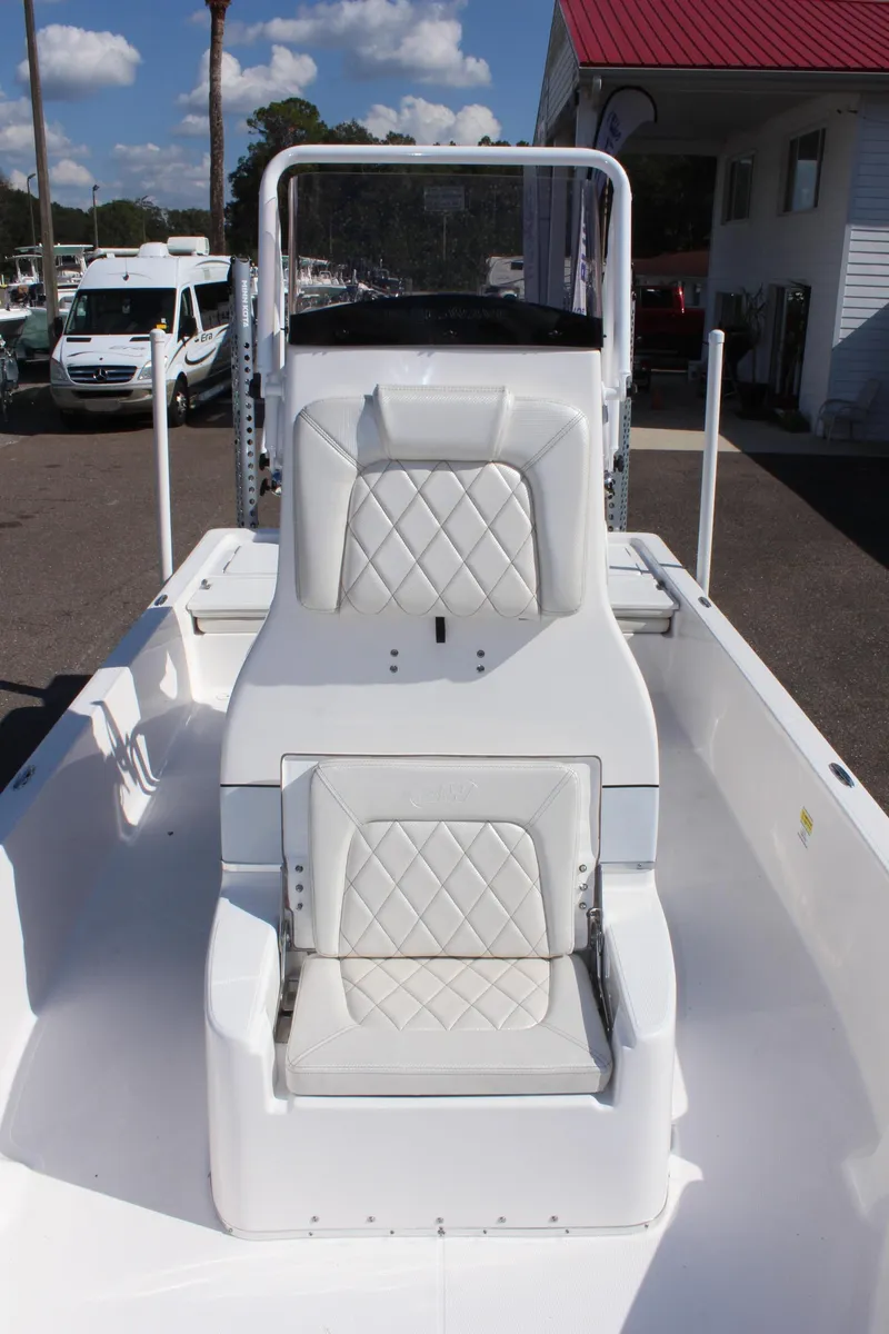 Slide: The Image of 2024 Blue Wave 2200 STL boat with white seating and console. - 43