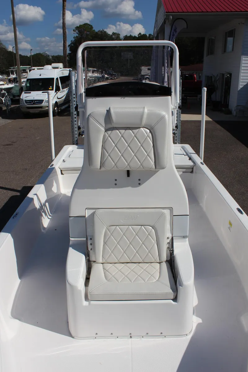 Slide: The Image of 2024 Blue Wave 2200 STL boat interior with white cushioned seating. - 44