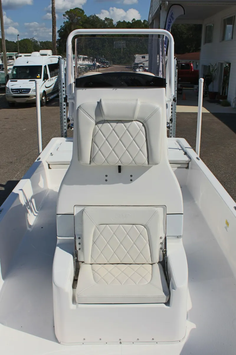 Slide: The Image of 2024 Blue Wave 2200 STL boat with white seating and diamond-stitched upholstery. - 45