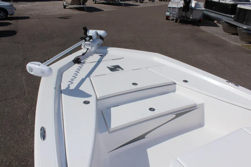 Slide: The Image of 2024 Blue Wave 2200 STL boat bow with trolling motor and storage compartments. - 48