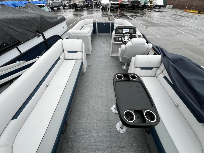 Slide: The Image of 2024 Godfrey SWEETWATER 2286 SB pontoon boat interior with spacious seating and modern helm. - 10