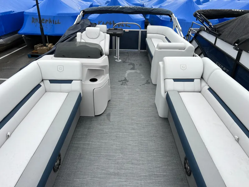 Slide: The Image of 2024 Godfrey SWEETWATER 2286 SB pontoon boat interior with spacious seating and helm. - 4