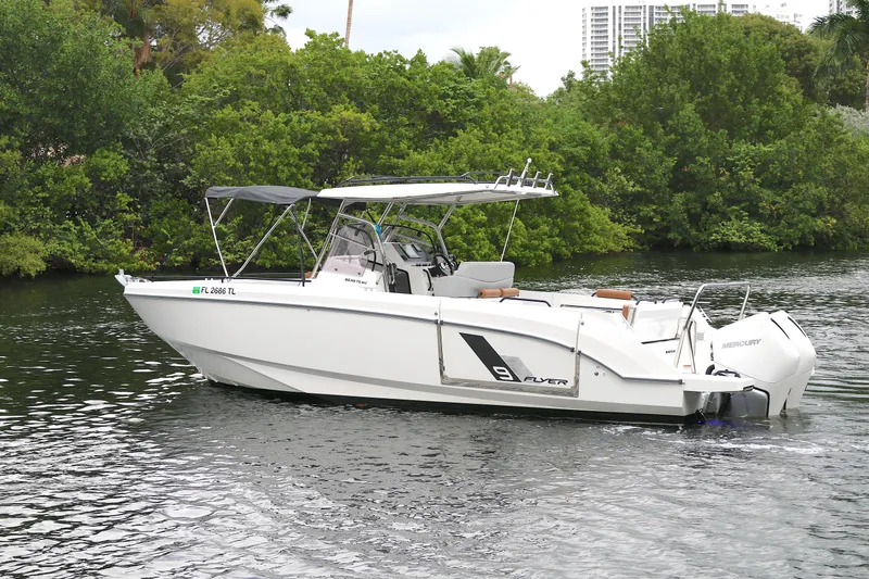 The Image of 2022 Beneteau FLYER 9 SPACE DECK boat cruising on a calm river. - 0