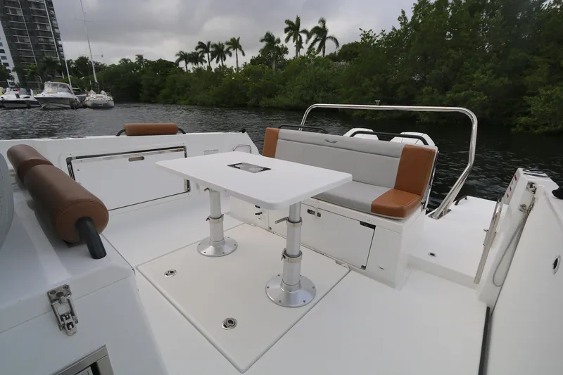 Slide: The Image of 2022 Beneteau FLYER 9 SPACE DECK boat with seating and table on deck. - 12