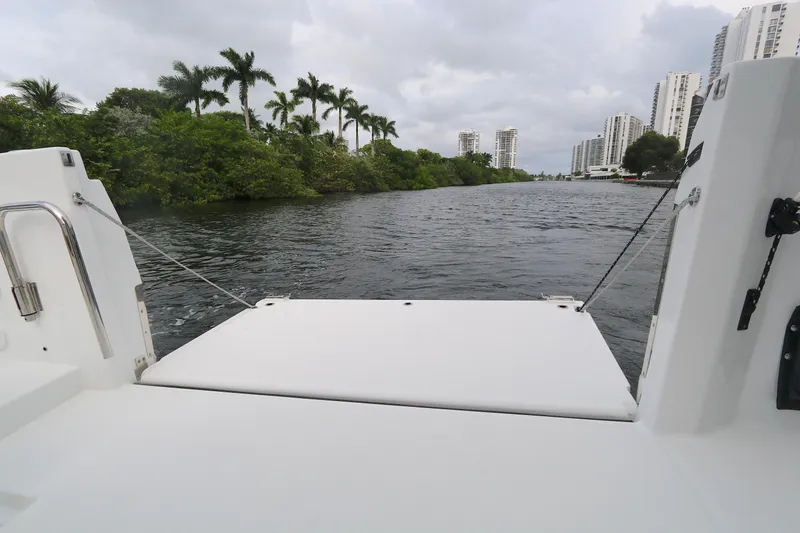 Slide: The Image of Beneteau FLYER 9 SPACE DECK 2022, view of waterway with lush greenery and buildings. - 16