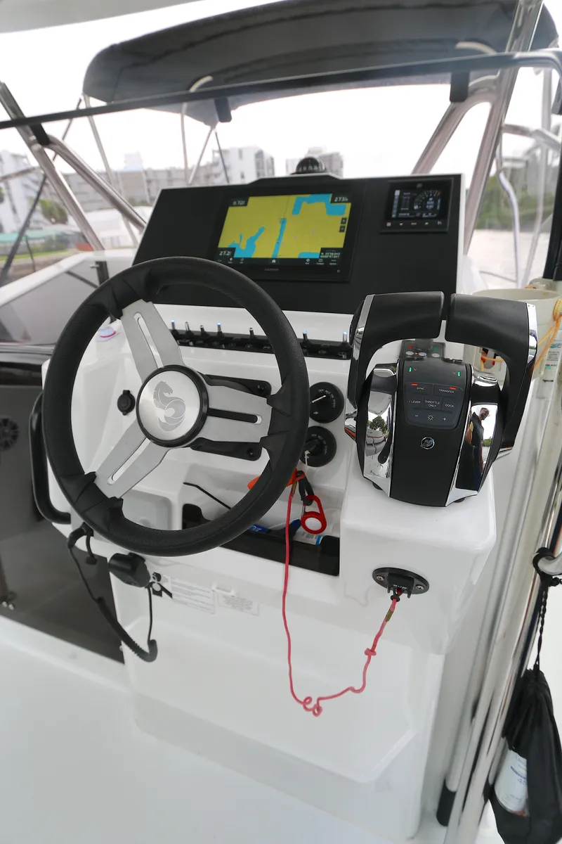 Slide: The Image of Steering console of 2022 Beneteau FLYER 9 SPACE DECK with navigation display. - 2
