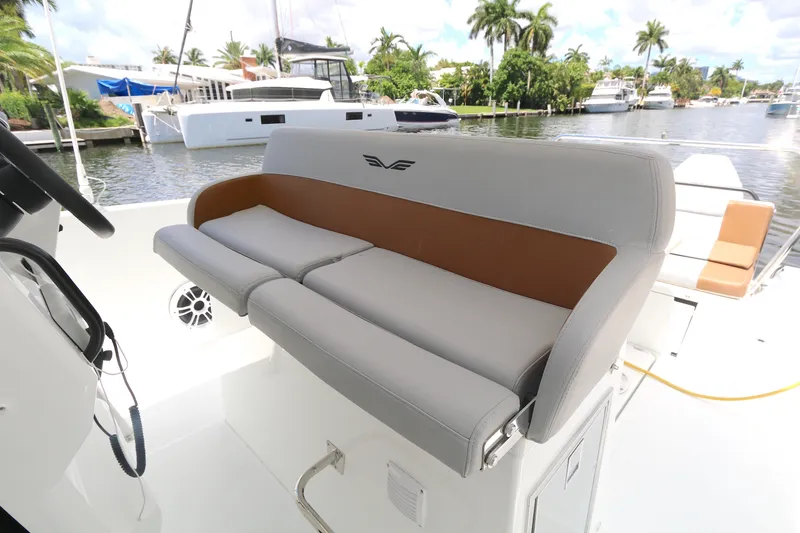 Slide: The Image of 2022 Beneteau FLYER 9 SPACE DECK boat interior with cushioned seating by the water. - 3